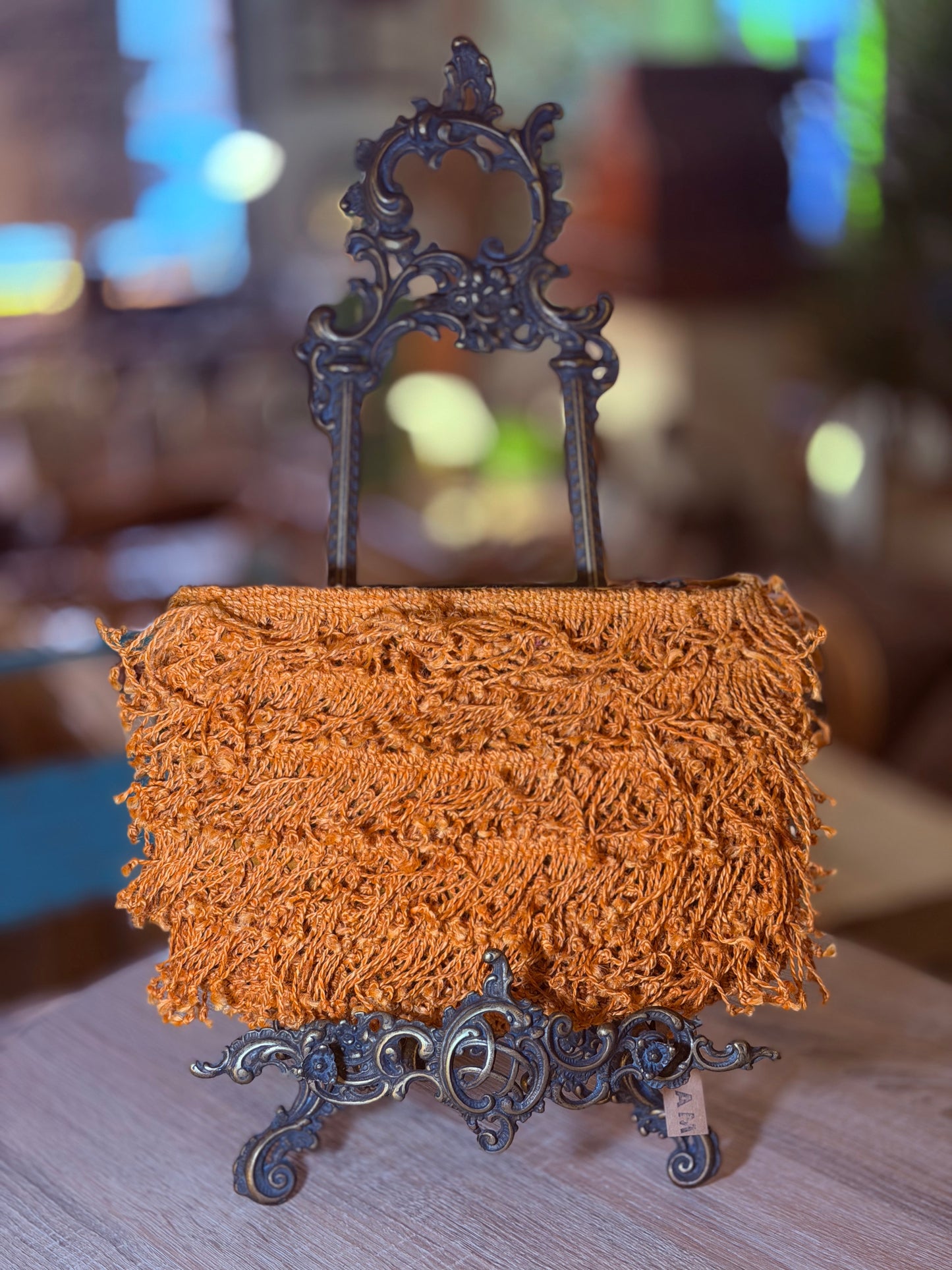 Bolso mano flecos naranja